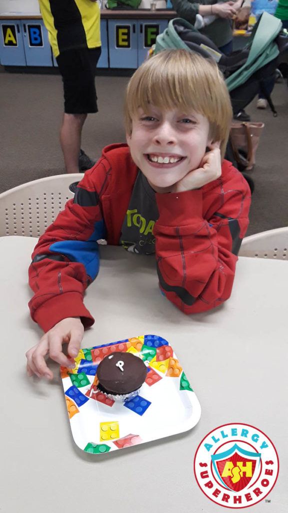 Our happy son with is food allergy safe for him cupcake (from Better Bites) at a birthday party by Allergy Superheroes.