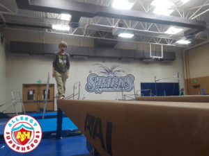 Zax walking the balance beam at a food allergy inclusive birthday party by Allergy Superheroes.