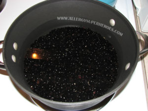 Black beans soaking in a pot of water | by Food Allergy Superheroes