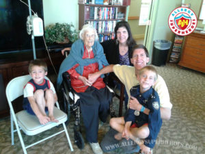 Family sitting with Grandma who has a feeding tube | by Allergy Superheroes