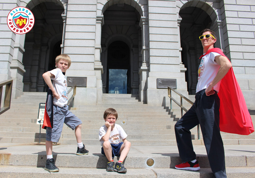 The Allergy Superheroes Family in superhero poses on the steps of the Colorado State Capitol | by Food Allergy Superheroes