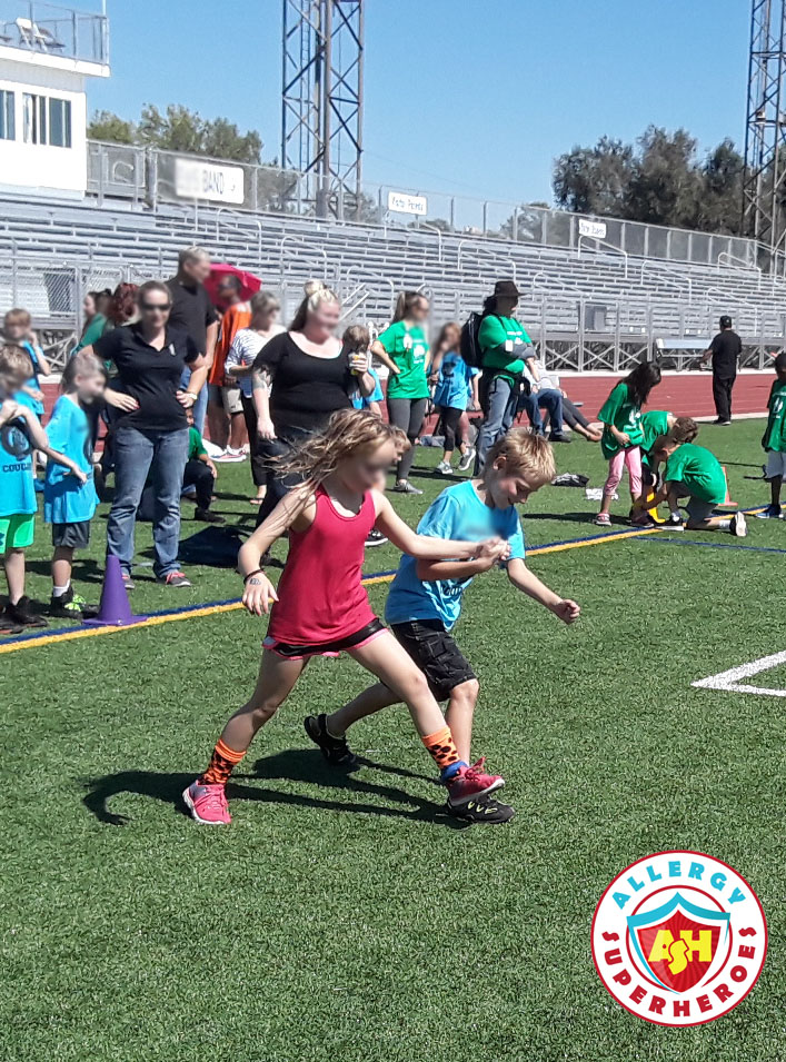 Children having a three legged race | Food Allergy Superheroes